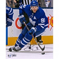 Autographed Toronto Maple Leafs John Tavares Fanatics Authentic 8 x 10 Blue Jersey Skating with Puck Vertical Photograph