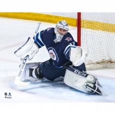 Unsigned Winnipeg Jets Connor Hellebuyck Fanatics Authentic Blue Jersey Glove Save Photograph